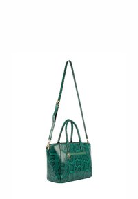 Borsa a tracolla verde con stampa serpente, dotata di manici doppi e tracolla removibile. Presenta dettagli in metallo dorato e una tasca con zip sulla parte anteriore.
