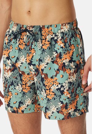 Schwimmshorts mit floralem Muster in Grün-, Orange- und Weißtönen. Elastischer Bund mit verstellbarem Kordelzug. Leichter, glatter Stoff.