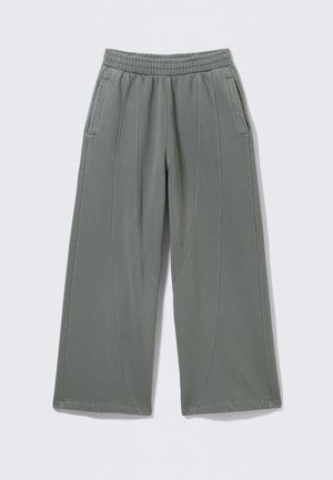 Hellgraue, weit geschnittene Hose aus weichem Stoff, mit elastischem Taillenbund und zwei seitlichen Taschen, versehen mit sichtbaren Nähten.