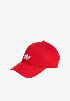 Red baseball cap made of fabric featuring a white embroidered logo on the front. Curved visor and adjustable strap.