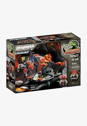 Opakowanie zestawu Playmobil Dino Rise przedstawia szary pojazd z pomarańczowymi akcentami, postacie w czerwonych hełmach oraz tło jaskini, ukazując scenę akcji.