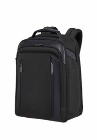 Zaino nero con superficie testurizzata, molteplici scomparti con zip, schienale imbottito e maniglia superiore per il trasporto.