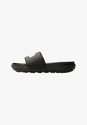 Black slide sandal with a textured upper strap, lightweight material, and a thick, rugged sole for grip. Accented with a logo on the strap.