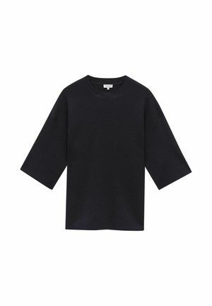 Haut noir à manches courtes en tissu doux, avec un col rond et une coupe décontractée à l'ourlet droit. Pas de motifs ni d'accents visibles.
