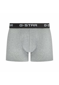 Grey cotton boxer briefs featuring a black waistband with "G-STAR" branding. The fabric has a smooth texture and a fitted design.