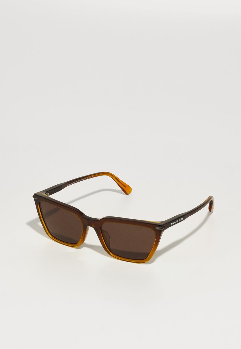 Brown rectangular sunglasses with a tortoiseshell frame, orange accents on the arms, and dark lenses featuring a logo on the side.