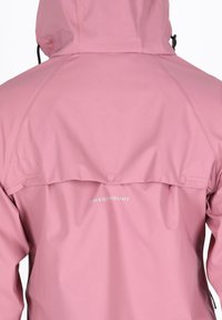 Pink waterproof jacket featuring a hood, snap closure at the back, and white brand logo "SWEDEMOUNT" near the hem. Smooth texture.