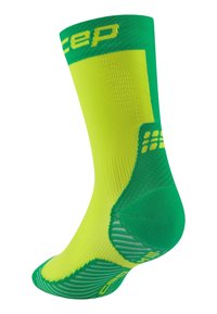 Grün und neongelbes Sport-Sockenpaar mit strukturierten Mustern, geripptem Bündchen und verstärkter Ferse. Leichtes, atmungsaktives Material.