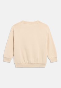 Μπεζ μακρυμάνικο φούτερ με ριμπ μανσέτες και τελείωμα, εμφανιζόμενο από πίσω σε απλό λευκό φόντο.