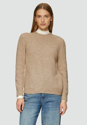 Beige ribbed sweater with long sleeves, crew neckline, and subtle texture. Worn over a white collar shirt. Classic fit, casual design.