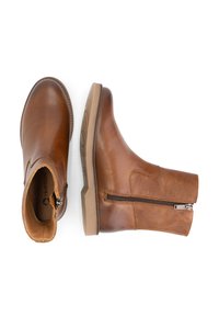 Bruine leren enkellaarsjes met een zijrits, ronde neus, gestructureerd bovenwerk en duurzame rubberen zool. Gladde afwerking met subtiele stiksels.