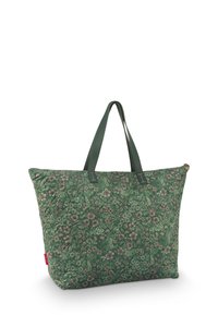 Gequilted tote bag in een donkergroen bloemenpatroon, met textuurstof, dubbele groene hengsels en een ritssluiting.