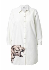 Valkoinen nappipaita, jossa on pitkät hihat ja leopardin pään graafinen kuva painettuna vasemmalle alareunalle. Pehmeä, sileä kangastekstuuri.