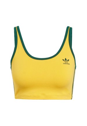 Gul crop top med grønn kant; laget av mykt stoff. Har et Adidas-logo i grønn på venstre bryst og side-striper.