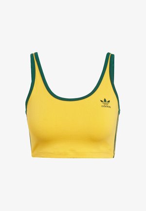 Top cropped amarelo com bordas verdes; feito de tecido macio. Apresenta um logo da Adidas em verde no lado esquerdo do peito e riscas laterais.