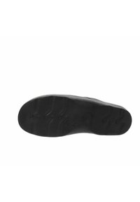 Suola di scarpa in gomma nera con superficie texturizzata, dotata di motivi di trazione curvi e dettagli di dimensionamento impressi. Finitura complessivamente liscia.