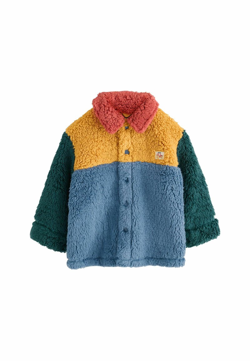 Veste bouton-up en peluche pour enfants avec des blocs de couleur : col rouge, partie supérieure jaune, torse bleu et manches vertes.