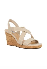 Beige wedge sandaaltjes met kruislings leren banden en een kurkachtige structuur in de hak. Soepele voetbed en rubberen zool voor grip.