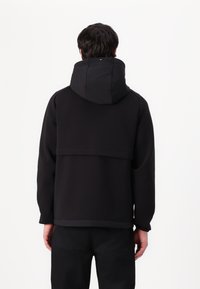 Tommy Hilfiger PERFORMANCE MIXMEDIA WINDBREAKER - Chaqueta de entretiempo - black