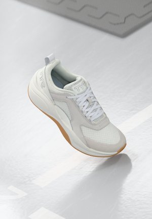 White athletic shoe made of mesh and synthetic materials. Features rounded toe, lace-up closure, light gray accents, and gum sole.
