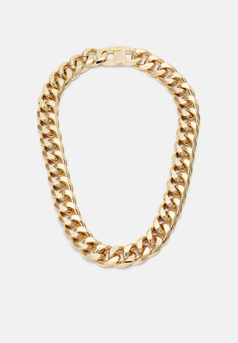 Collier chaîne en or épais avec de grands maillons ovales et un fermoir sécurisé sur fond blanc.