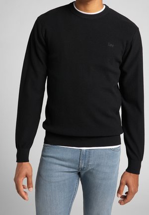 Stickad tröja - black