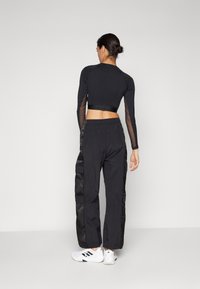 adidas Sportswear CARGO PANT - Hlače - black