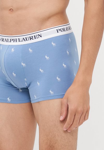 Modre bokserske hlače z belim pasom blagovne znamke Polo Ralph Lauren, ki vsebujejo ponovljen mali bel vzorec konja na tkanini.