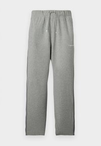 Lysegrå joggingbukser med elastisk taljebånd, snøre, sorte striber i siden og lille hvid Calvin Klein-logo foran.