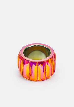 Wide cylindrical ring with faceted orange and pink gemstones set around a reflective silver inner band on a white background.