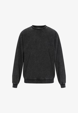 Czarny sweter z okrągłym dekoltem wykonany z miękkiego materiału. Posiada długie rękawy, ściągacze przy mankietach oraz lekko wyblakłą teksturę, co nadaje mu vintage'owego wyglądu.