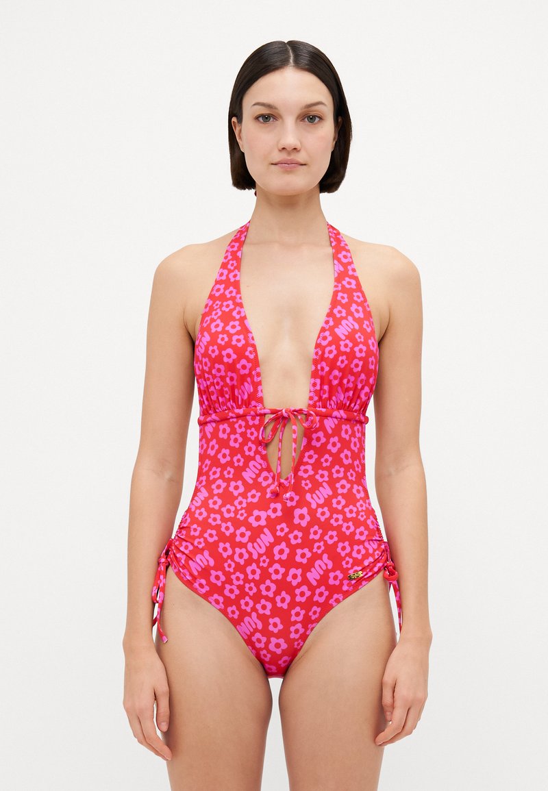 Κόκκινο μαγιό με λουλούδια και βαθύ ντεκολτέ, με κορδόνι μπροστά και ρυθμιζόμενους κορδόνους στο πλάι. Διαθέτει επαναλαμβανόμενο σχέδιο με λουλούδια και τη λέξη "ΗΛΙΟΣ".