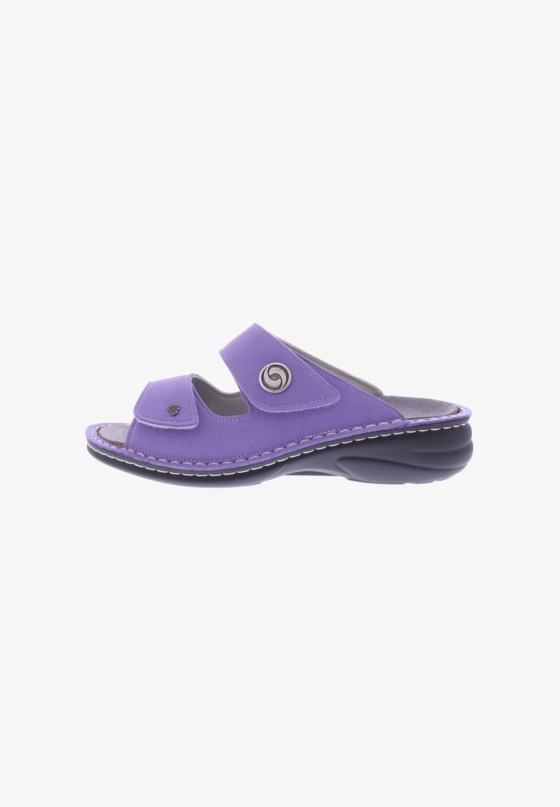 Purple slide sandal with two adjustable Velcro straps, soft inner lining, and a cushioned black sole. Features a circular metal accent.