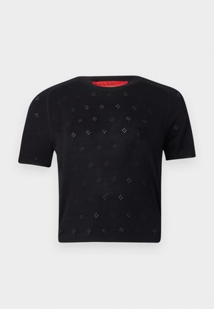 Top noir à manches courtes avec un col rond, présentant des découpes en forme de diamant et une texture lisse. Étiquette rouge visible au niveau du col.