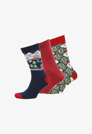 Three pairs of socks: navy with mountain scene, solid red, and green with reindeer and Christmas trees, featuring contrasting toe colors.
