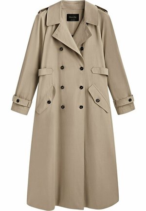 Trench-coat long beige à double boutonnage avec boutons noirs, large col, épaulettes, poches à rabat et brides aux poignets.