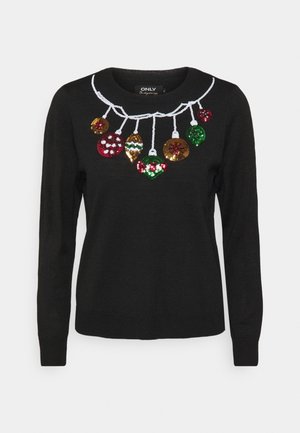Pull noir à manches longues avec des ornements de Noël pailletés suspendus à une ficelle blanche sur la poitrine.