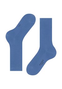 Chaussettes en coton bleu avec une texture douce, des bords côtelés et des orteils renforcés. Présente une marque imprimée sur la semelle.