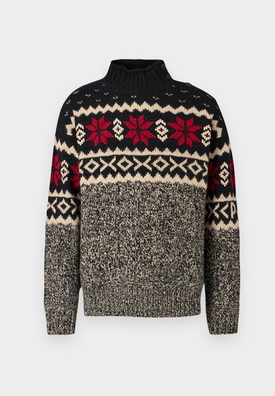 Pleteni pulover s crnom podlogom i crvenim i kremastim uzorcima pahuljica i geometrijskim oblicima. Visoki ovratnik s dugmadima i rebrastim manžetama.