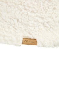 Cream-colored fleece fabric with a soft, textured surface; features a tan label with the text "Sterntaler" stitched on the edge.