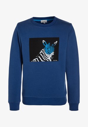 Sweatshirt bleu en coton avec un col rond, présentant un graphique carré noir d'une tête de zèbre en blanc et turquoise.