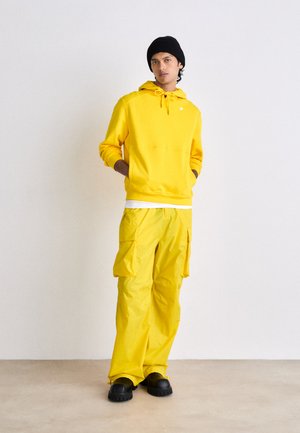 EXCLUSIVE UNISEX - Pantalon cargo - yellow dark