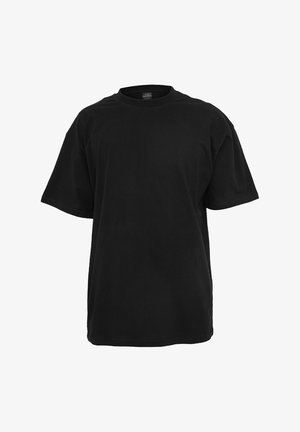 T-shirt en coton noir à coupe décontractée, manches courtes, encolure ronde et texture lisse et uniforme. Aucun logo ou motif visible.