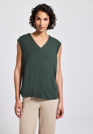 Grüne ärmellose Bluse mit V-Ausschnitt, aus einem weichen Material. Hat eine lockere Passform und eine vertikale Nahtdetail in der Mitte.
