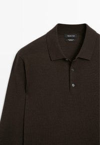 Brown wool polo shirt with a soft texture, three buttons, and a classic collar. Brand tag visible inside collar area.