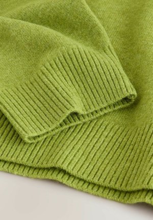 Green knitted sweater featuring ribbed texture, smooth fabric, and a loose fold. Soft material with a cozy appearance.