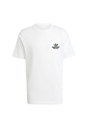 White cotton t-shirt with short sleeves, featuring a black printed logo on the left chest reading "superstar MILAN" and an iconic trefoil accent.
