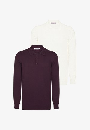 Twee polo shirts met lange mouwen: één in donkerpaars, de andere in het wit. Beide hebben een klassieke kraag en een knoopsluiting met drie knopen. Gemaakt van een katoenmix.