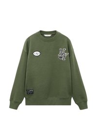 Felpa verde oliva con un patch rotondo con la scritta "NY" e un'etichetta sull'orlo inferiore. Realizzata in materiale morbido con un classico scollo rotondo.