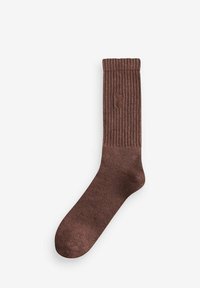 Braune gerippte Socke aus einem strukturierten Material, mit einem umgeschlagenen oberen Rand und einem kleinen Logodesign an der unteren Seite.